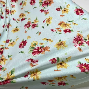 Tissu jersey coton viscose stretch fleurs d'été turquoise